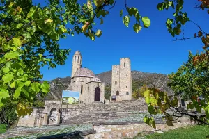 Mountainous Prints: Vatan memorial complex shows historic architecture against blue sky in Dagestan, Russia