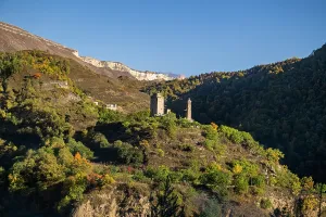 Viewpoint Prints: Vatan memorial complex stands in the mountains of Dagestan with trees and hills surrounding it