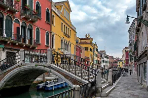 Waterfront Dining Prints: Venice street with colorful houses and a bridge over the canal with boats