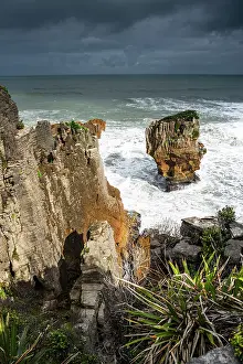 Punakaiki Prints: Vertical View of Pancake Rocks and Surf Below with Flax and Cliffside Vegetation in Punakaiki