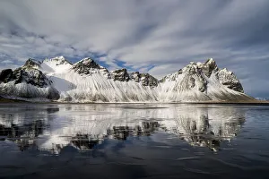 Vestrahorn Mountain reflected in wet sand, Iceland, Polar Regions