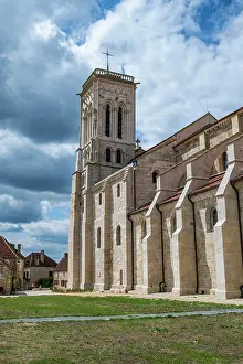 Gardens Prints: Vezelay Abbey stands tall in the historic hill town amid changing skies in France