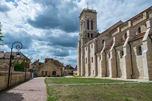 Visitor Prints: Vezelay Abbey and surrounding buildings under a cloudy sky in France