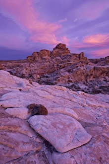 Gold Butte Prints: Vibrant orange clouds over red and white sandstone at sunset