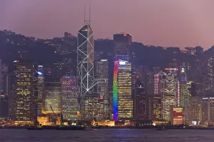 Illusion Prints: Victoria Harbour, night view of skyscrapers in Central district of Hong Kong Island