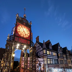 The Victorian Eastgate Clock on the city walls at night, Eastgate Street, Chester, Cheshire, England, United Kingdom, Europe