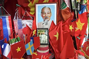 Stall Prints: Vietnamese flags and portraits of Ho Chi Minh in a tourist shop