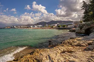 Sunbathing Prints: View of Akti Navarchou Nearchou Beach in Crete with coastline