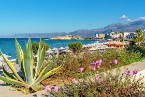 Umbrellas Prints: View of Akti Navarchou Nearchou Beach in Limenas Chersonisou on a sunny day in Crete Greek Islands