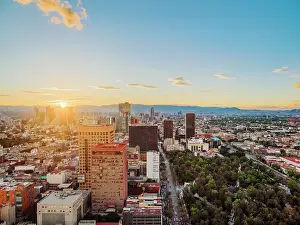 Downtown Prints: View over Alameda Central towards High-rise buildings of Paseo de la Reforma at sunset