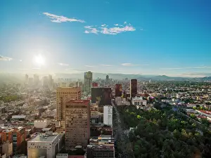 View over Alameda Central towards High-rise buildings of Paseo de la Reforma at sunset, Mexico City, Mexico