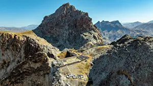 Significance Prints: View of Alinja castle on a rocky hill in Azerbaijan with mountain landscape and clear sky
