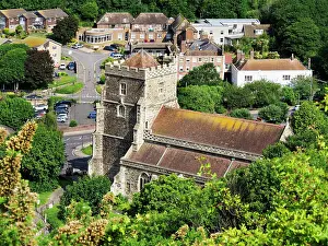 Hastings Prints: View of All Saints Church in Hastings shows church building surrounded by greenery and houses in East Sussex