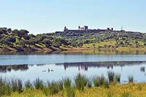 Alentejo Prints: View of Alqueva dam lake with reflections and castle on Guadiana River near Mourao in Alentejo Portugal