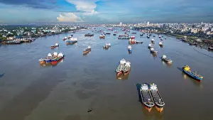Fishermen Prints: View of anchoring boats on Karnaphuli River near fish market in Chittagong Bangladesh during daylight hours