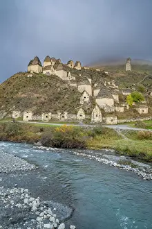 Terrain Prints: View of the ancient burial structures in Dargavs near a river in North Ossetia