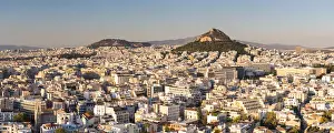 View of Athens and Likavitos Hill over the rooftops of the Plaka District from The Acropolis