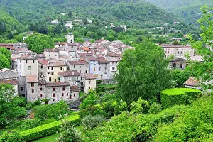 Roofs Prints: View of Aulas village on the bank of the Coudoulous River in the Cevennes range of Gard department in France