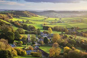 View in autumn over the village of Corton Denham and countryside at sunset, Corton Denham