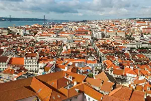 Roofs Prints: View of Baixa and Chiado districts from Sao Jorge Castle with Tage River in background in Lisbon