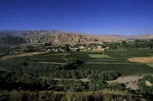 View of Bamiyan showing cliffs with two empty niches where the famous carved Buddhas stood