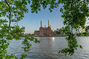 Electricity Prints: View of Battersea Power Station beside river Thames in summer at Nine Elms in London