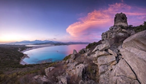 View of the bay and beaches from the stone tower at sunset, Porto Giunco, Villasimius