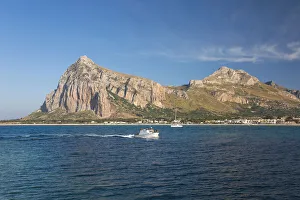 Trapani Prints: View across the bay to Monte Monaco and Pizzo di Sella, small boat returning to port