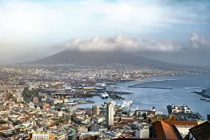 Cruise Prints: A view of the Bay of Naples with the cruise liner port in the foreground and Mount Vesuvius in the background