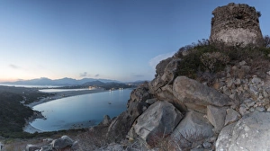 Cagliari Prints: Top view of the bay with sandy beaches and lights of a village at dusk, Porto Giunco