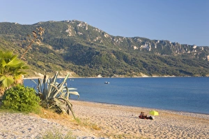Agios Georgios Prints: View across the bay to wooded hillside