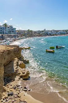 Limenas Prints: View of a beach with boats in Limenas Chersonisou, Crete during sunny weather in Greece