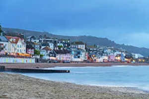 House Exterior Prints: View from the beach of the colouful village of Lyme Regis at dusk