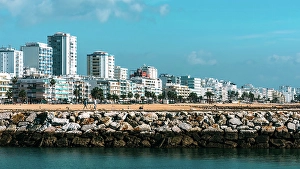 Vacationers Prints: View of beach and promenade at Quarteira, Algarve, Portugal