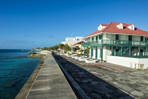 Colonialism Prints: View of the beachfront with the colonial houses of Cockburn Town