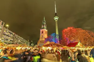 Bustling Prints: View of Berlin TV Tower, St. Mary's Church and Christmas market in Wasserkaskaden at dusk