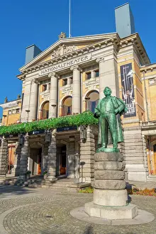 Visitor Attraction Prints: View of Bjornstjerne Bjornson statue and the entrance of the National Theatre from Stortingsparken