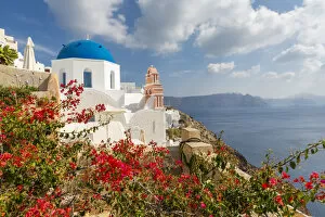 Traditionally Greek Gallery: View of blue domed church and sea in Oia village, Santorini, Aegean Island, Cyclades Island