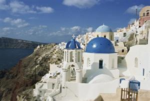 View over the blue domes and white houses of the village of Oia