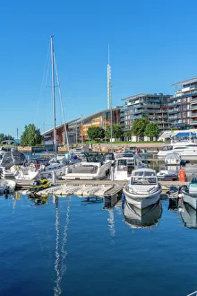 Watercraft Prints: View of boats and architecture at the waterfront