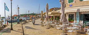 Outdoor Seating Prints: View of boats and cafes in the harbour in Gaios Town