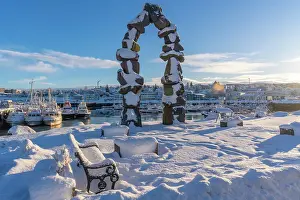 Docks Prints: View of boats in Hafnarfjorour Marina and town in background in winter