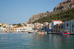 Cafes Prints: View of boats and houses lining the harbor of Megisti Bay in Kastellorizo