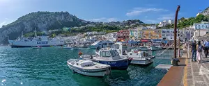 Isle Prints: View of boats in Marina Grande overlooked by Capri Town in the background