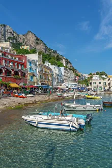 Docked Prints: View of boats in Marina Grande and shops and cafes on the quayside