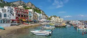 Docked Prints: View of boats in Marina Grande and shops and cafes on the quayside
