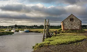 Wooden Post Gallery: A view of boats moored in the creek at Thornham, Norfolk, England, United Kingdom, Europe