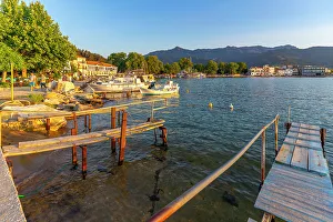 Ancient Ruins Prints: View of boats in old harbour in Thassos Town during golden hour