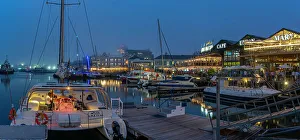 Chair Prints: View of boats and restaurants in the Waterfront at dusk