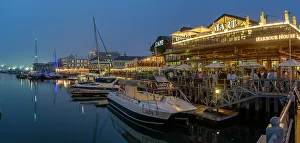 Chair Prints: View of boats and restaurants in the Waterfront at dusk